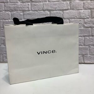 Vince Empty Shopping Paper Bag in white.